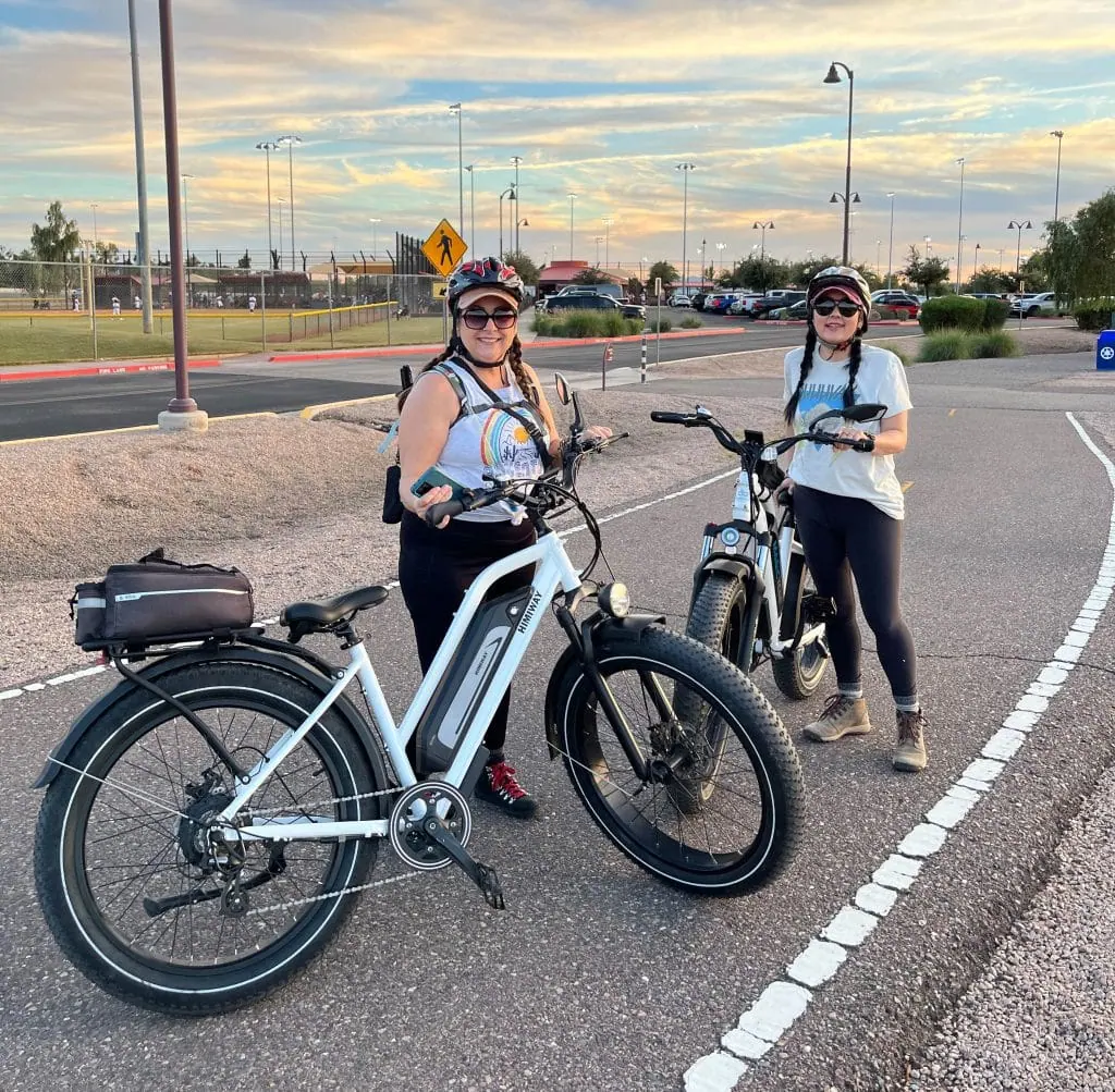 Women riding Smittys E-Bikes, stylish electric bikes for leisure and commute.
