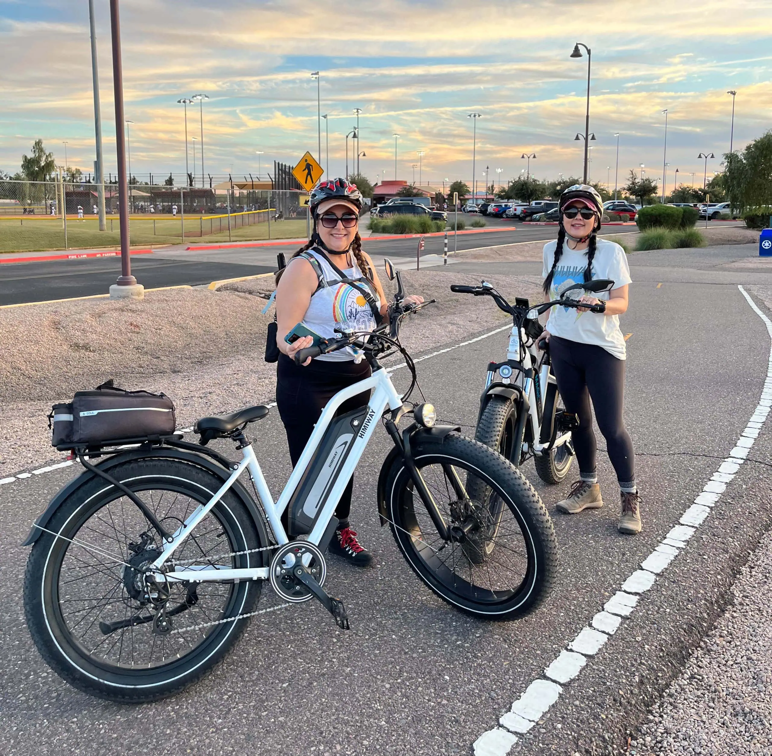 E-bike Riders Enjoying Outdoor Ride with Smittys E-bikes, Perfect for Eco-friendly Transportation and Adventure. - Smittys E-bikes Women riding Smittys E-Bikes, stylish electric bikes for leisure and commute.